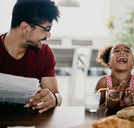 father and daughter laughing together