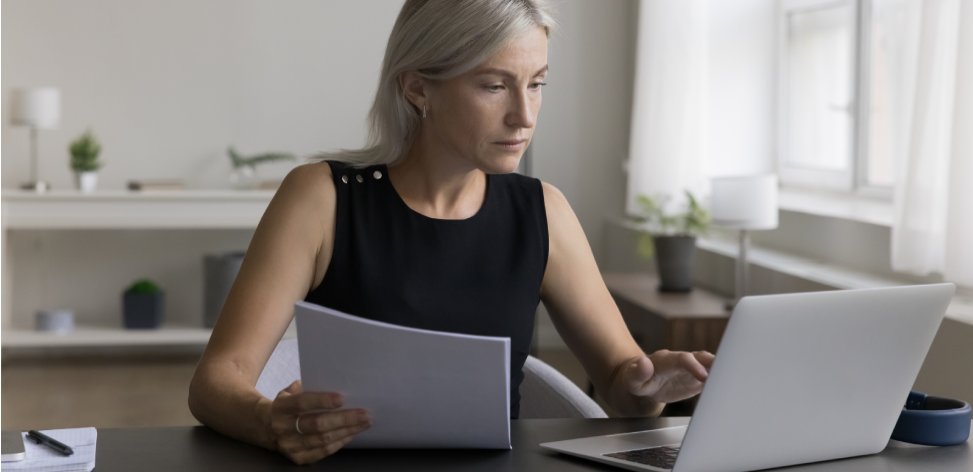 A woman goes over her checking account fees.