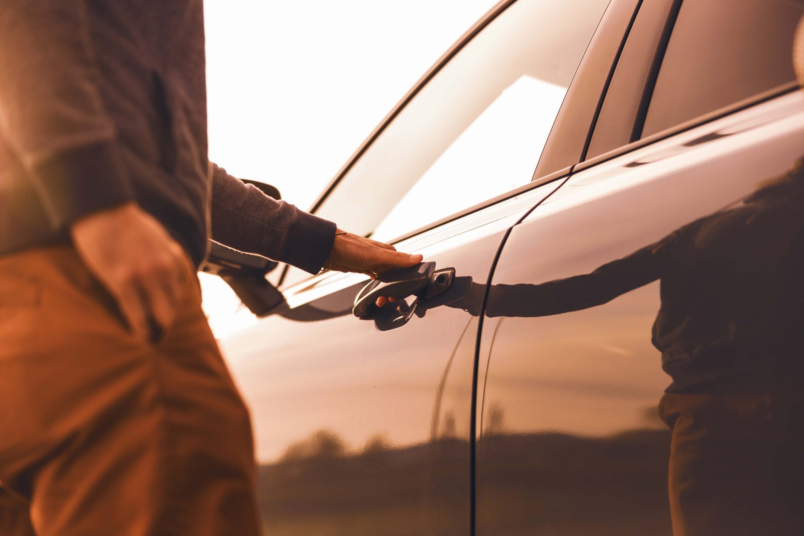 auto loan approved customer opening car door