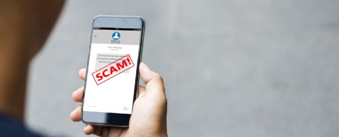 A phone indicates a message is a scam.