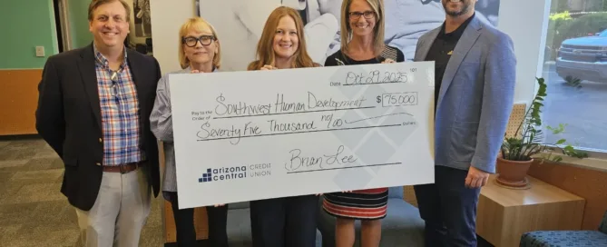 Members holding $75,000 grant check