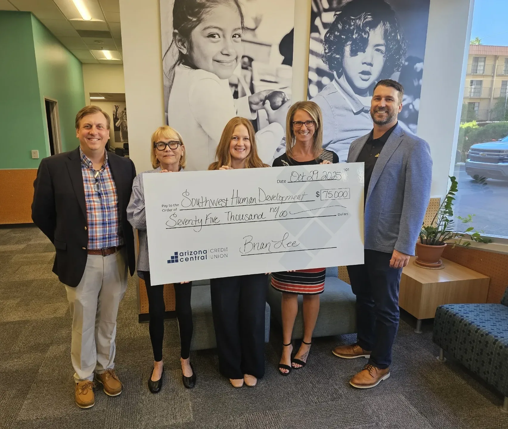 Members holding $75,000 grant check