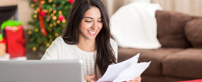 A woman checks her holiday bills.